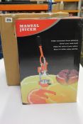 Two boxed as new Microgadgets manual juicers in Orange.