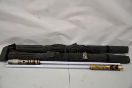 Two pre-owned Savi's workshop lightsabers with sheaths.