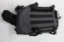 Three 5.11 Rapid sling back backpacks in coal.