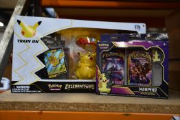 A boxed as new Pokemon Celebrations premium figure collection box and a boxed as new Morpeko pin