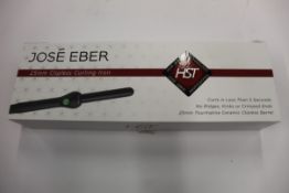A boxed as new Jose' Eber HST 25mm Clipless Curling Iron (Some minor damage to packaging).