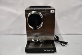A pre-owned Nespresso Momento 100 Professional Coffee Machine (Type 230/NP100, item powers on but