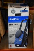 A boxed as new Nilfisk Core 130 high pressure washer with value pack.