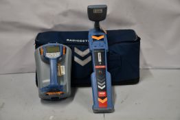 A pre-owned Radiodetection RD7100 cable and pipe locator and a TX-10 transmitter all in a soft carry