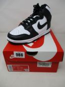 A pair of women's Nike Dunk high retro black white trainers (Size UK 3) (Outer box damaged).