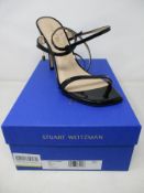 A pair of Stuart Weitzman Ellsie 100 black patent heeled sandals (Size EU 40.5).