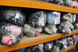 Twelve bags of assorted clothing and related items.