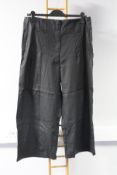 Two pairs of as new Lurdes Bergada Wide coated trousers (M - RRP £93 each).