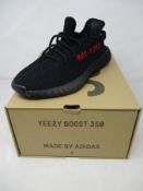 A pair of boxed as new Adidas Yeezy Boost 350 V2 in black/red (UK 9).