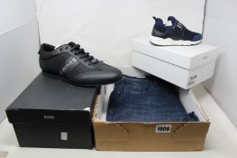 A pair of men's Hugo Boss black low sneakers (Size UK 11), a pair of junior Hugo Boss blue slip on