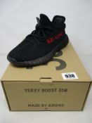 A pair of boxed as new Adidas Yeezy Boost 350 V2 in black/red (UK 5).