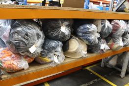 Twelve bags of assorted clothing and related items.