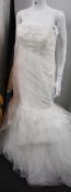 An as new Vera Wang Bride Laurence strapless fit and flare wedding dress with open back (UK 18).