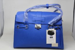 An as new Nova Harley Luxury Elegant Blue leather changing bag.