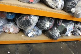 Twelve bags of assorted clothing and related items.