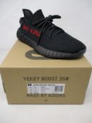 A pair of boxed as new black/red Yeezy Boost 350 V2 originals (UK 8).