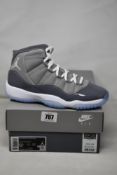 A pair of boxed as new Nike Air Jordan 11 Retro (GS) in cool grey (5.5Y, UK 5).