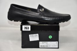 A pair of men's as new Just Cavalli Loafers in black (EU 45, some damage to box).