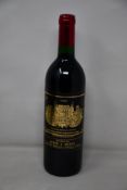 A bottle of 1990 Chateau Palmer Margeaux Medoc (Over 18s only).