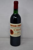 A bottle of 1989 Chateau-Figerac Premier Grand Cru St Emilion (Over 18s only).