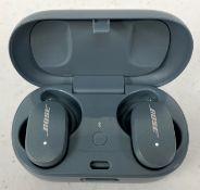 A pre-owned pair of Bose QuietComfort Earbuds with Charging Case in Blue.