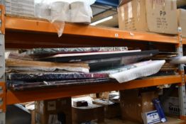 A large quantity of prints, posters, frames and other related items.