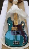 A boxed as new Fender Limited Edition Player Precision Bass Ocean Turquoise.