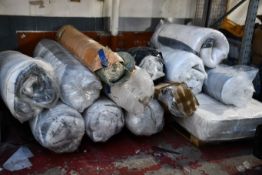 A quantity of mattresses in various different brands and sizes.