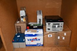 A quantity of assorted batteries and related.