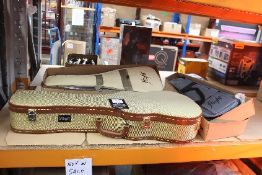 A Stagg Baritone Ukulele Case in Gold Tweed, a Flight NUC310 Concert Ukulele and a Flight NUS200