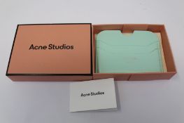 A boxed as new Acne Studios Leather Card Holder in Pastel Green.
