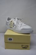 A boxed as new pair of Axel Arigato A-Dice Lo in White (Size UK 10).