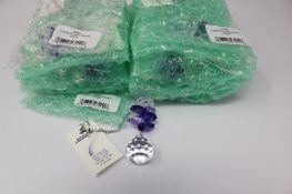 Twelve as new Woodstock Chimes Crystal Sunrise Cascade Sun-Catchers in Purple (EAN: 028375270118).