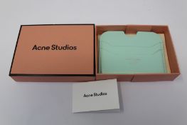 A boxed as new Acne Studios Leather Card Holder in Pastel Green.