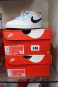 Two pairs of boxed as new Nike Court Borough Low 2 (GS) in black and white (UK 4.5/5Y).