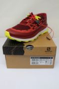 A pair of boxed as new Salomon Ultra Glide Trail Running Shoes in Biking Red/Lunar Rock/Evening