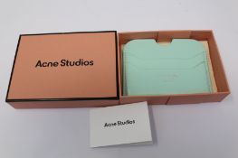 A boxed as new Acne Studios Leather Card Holder in Pastel Green.