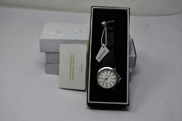 Two men's Timothy Stone watches from the Norse collection white face and black leather straps and