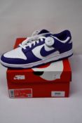 A pair of as new Nike Dunk Low Retro with authenticity tag (UK 9).