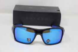 A boxed as new pair of Oakley Turbine Sunglasses in Black Ink with Prizm Sapphire Lens (REF: OO9263,