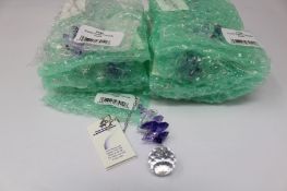 Twelve as new Woodstock Chimes Crystal Sunrise Cascade Sun-Catchers in Purple (EAN: 028375270118).
