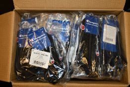 Twenty eight packs of three Champion sports socks in various sizes and colours.