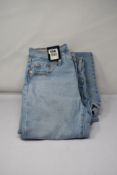 Three pairs of Levis 501 original cropped light wash jeans (1 x W26 L26, 1 x W27 L26, 1 x W23 x