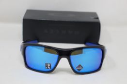 A boxed as new pair of Oakley Turbine Sunglasses in Black Ink with Prizm Sapphire Lens (REF: OO9263,