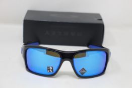 A boxed as new pair of Oakley Turbine Sunglasses in Black Ink with Prizm Sapphire Lens (REF: OO9263,