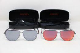 Two pairs of Ducati pilot sunglasses (DA7022) (907 58 12-140) and (900 58 12-140).