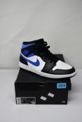 A pair of as new Nike Air Jordon 1 mid white/racer blue black (UK 10) (Slight damage to outer box).