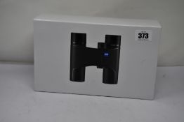 A pair of boxed as new Zeiss Victory Pocket 8x25 Compact Binoculars.