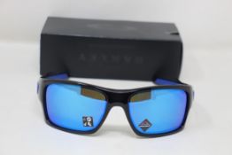 A boxed as new pair of Oakley Turbine Sunglasses in Black Ink with Prizm Sapphire Lens (REF: OO9263,