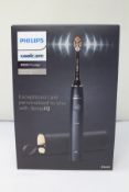 A boxed as new Phillips Sonicare 9900 power toothbrush with sense IQ.